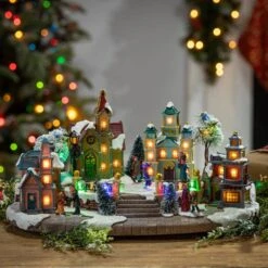 8.27 In. H Electric Christmas Lighted Musical Holiday Village 5 8.27 In. H Electric Christmas Lighted Musical Holiday Village -Northlight Shop gerson international christmas villages 2420010ec 31 1000