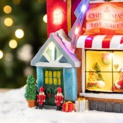 10.75 In. Lighted Toy Market Resin Christmas Village With Movement And Music -Northlight Shop glitzhome christmas villages 2040200004 76 1000