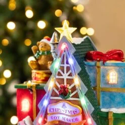 10.75 In. Lighted Toy Market Resin Christmas Village With Movement And Music -Northlight Shop glitzhome christmas villages 2040200004 fa 1000