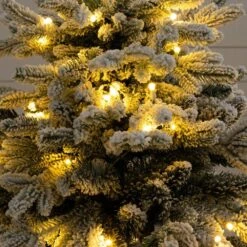 4 Ft. Pre-Lit Artificial Flocked Christmas Tree With 100-Warm White LED Lights In Decorative Trunk Planter -Northlight Shop nearly natural pre lit christmas trees t5405 fa 1000